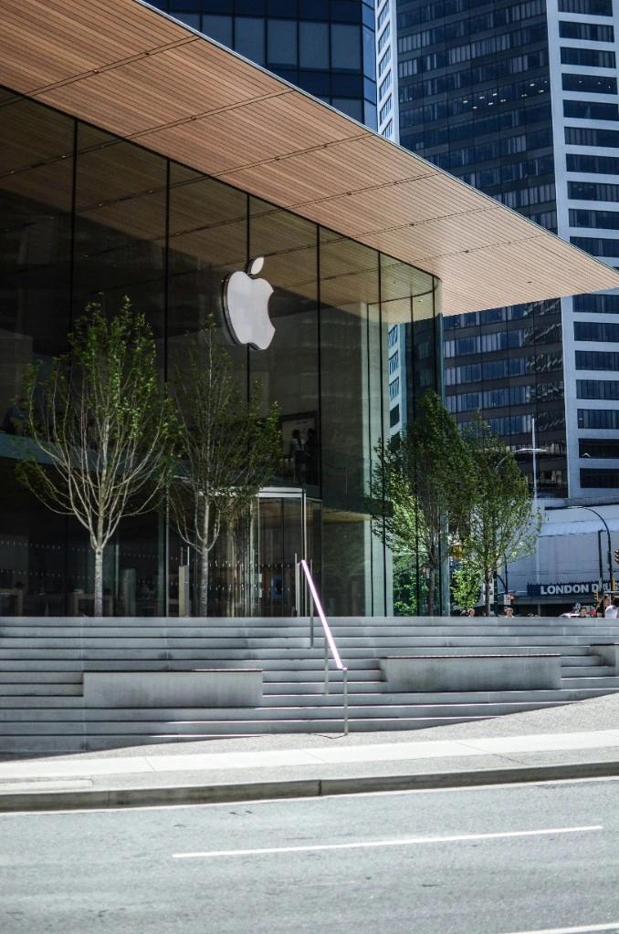 Commercial building with expansive clean glass facade and reflections