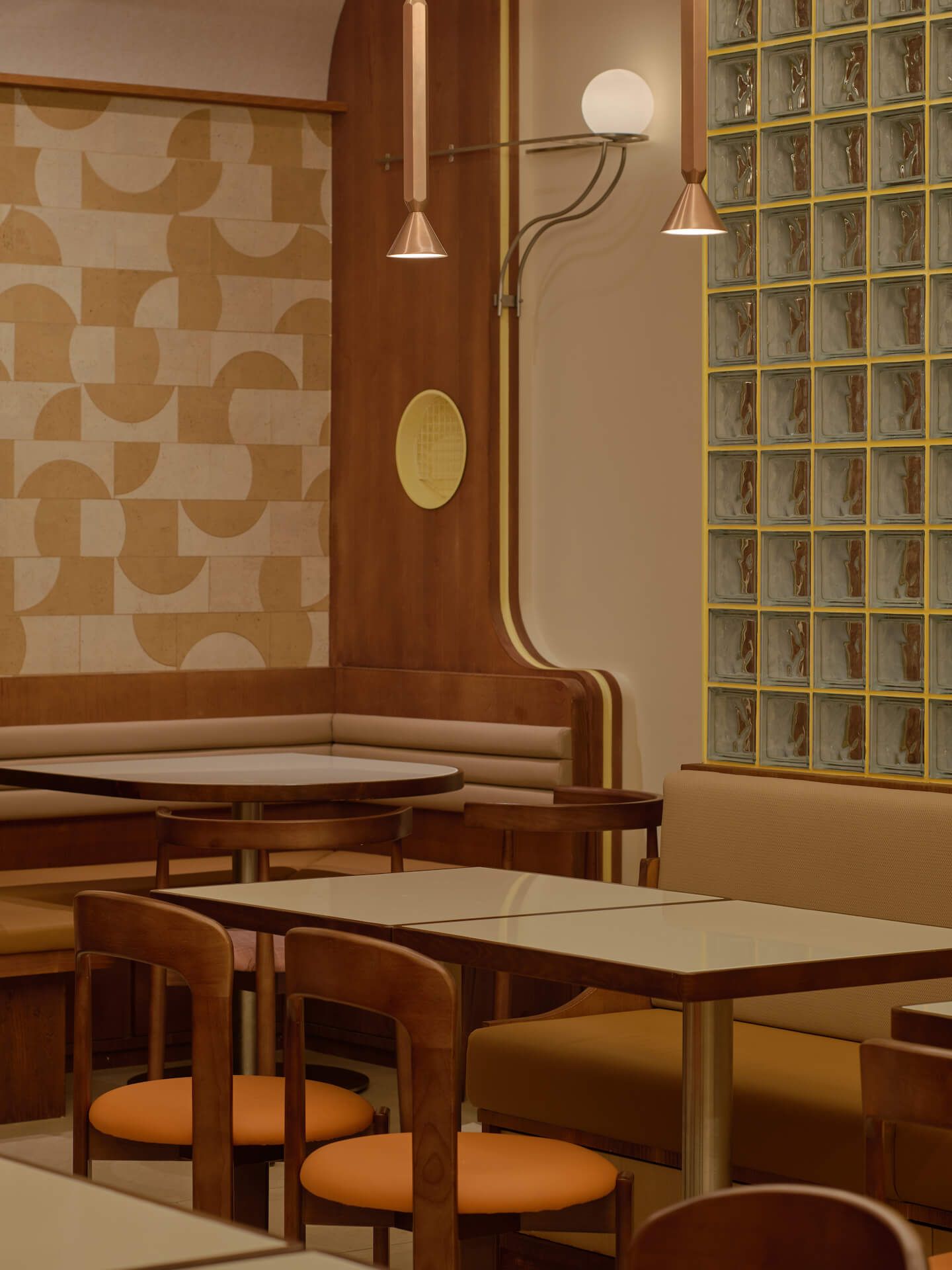 Dining room with full-height glass block wall, geometric tile feature wall, coffered grid ceiling and conical pendant lights, Tiong Bahru Chicken Rice at Takashimaya Singapore by LAANK