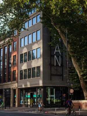 DSDHA's The Hickman view of main entrance with two cyclists going by on cycle pathway