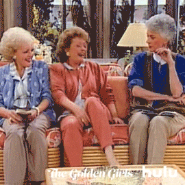 Golden+Girls+Dorothy+GIF+by+HULU.gif Three older women sit together on a couch laughing, from a classic sitcom.