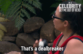 Imacelebrityau+GIF+by+I'm+A+Celebrity...+Get+Me+Out+Of+Here!+Australia.gif A woman with glasses sits among jungle rocks and ferns and says 'That's a dealbreaker.'