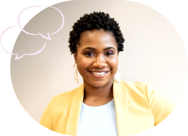 Smiling person with short curly hair wearing a yellow blazer, standing in front of a light background with speech bubble graphics.