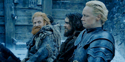 24362aa4-b43b-2723-b7e8-d667bd5a9d67.gif A bearded man, a dark-haired man and an armored blonde woman turn to look on with unimpressed expressions.