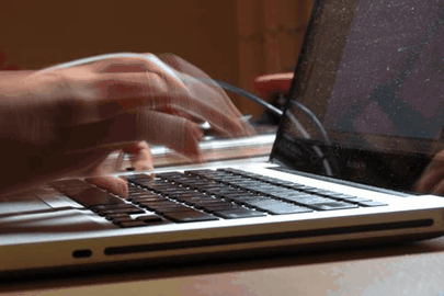 Close+Up+Typing.gif Close-up of a pair of hands typing quickly on a laptop keyboard.