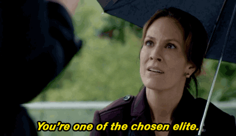 elite+fox+tv+GIF+by+The+X-Files.gif A woman under a black umbrella looks up and says 'You're one of the chosen elite.'