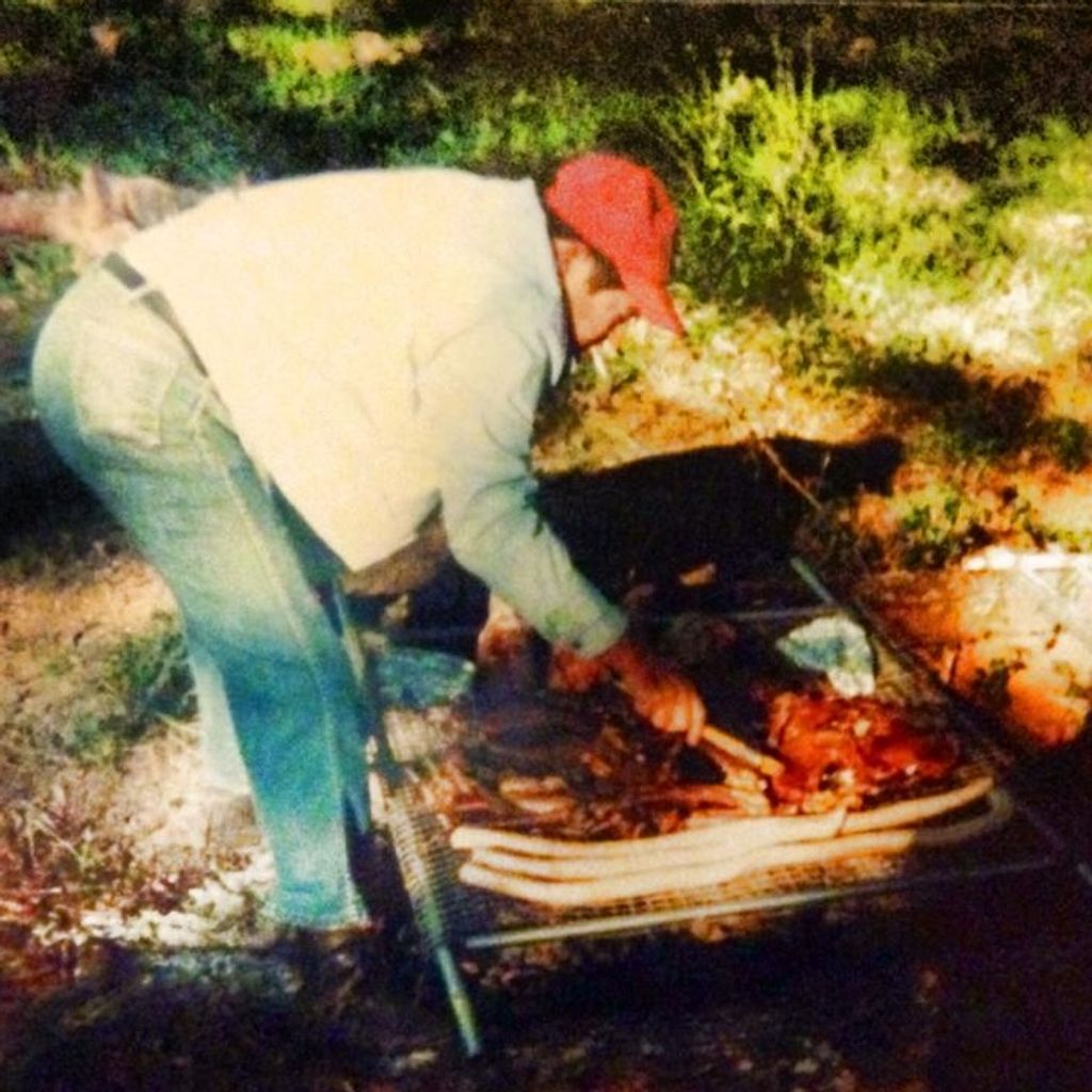 Don Sands cooking over open-fire