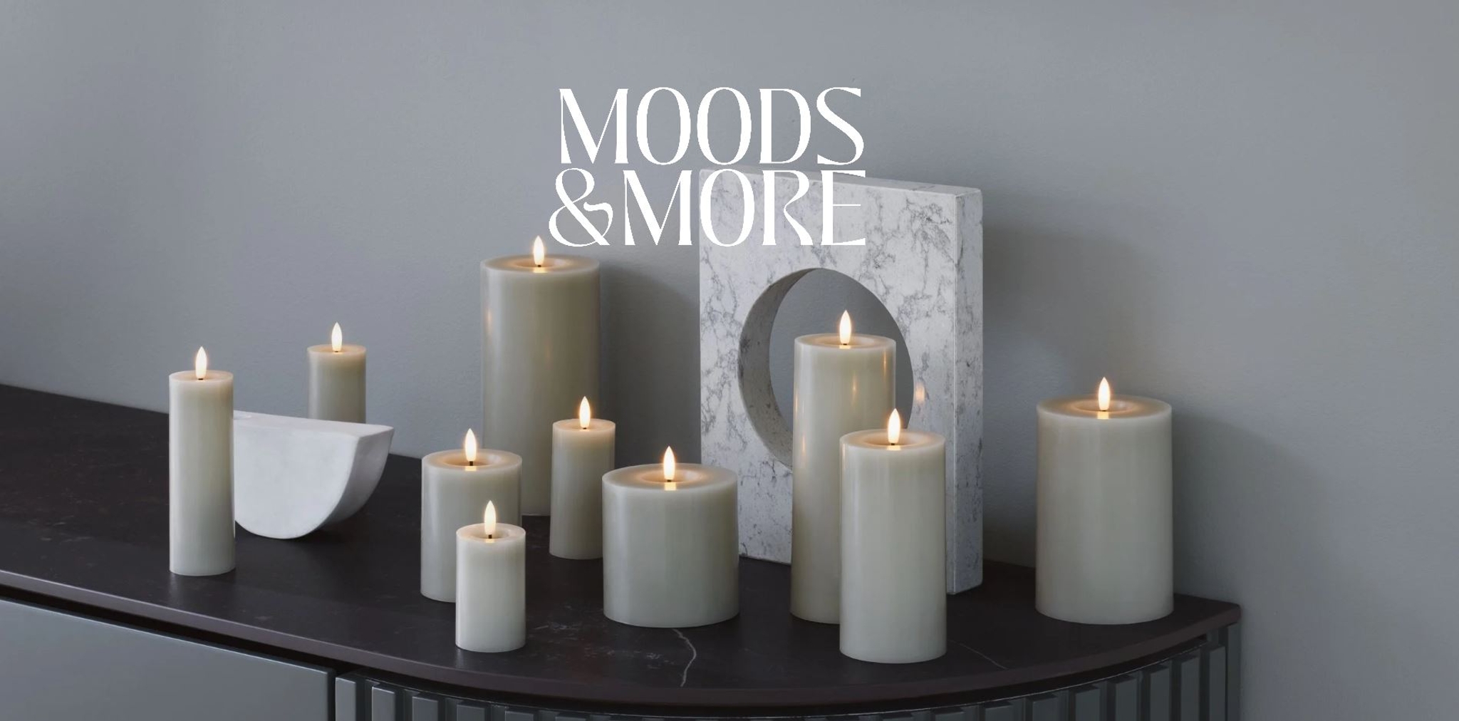 a bunch of candles are sitting on top of a table .