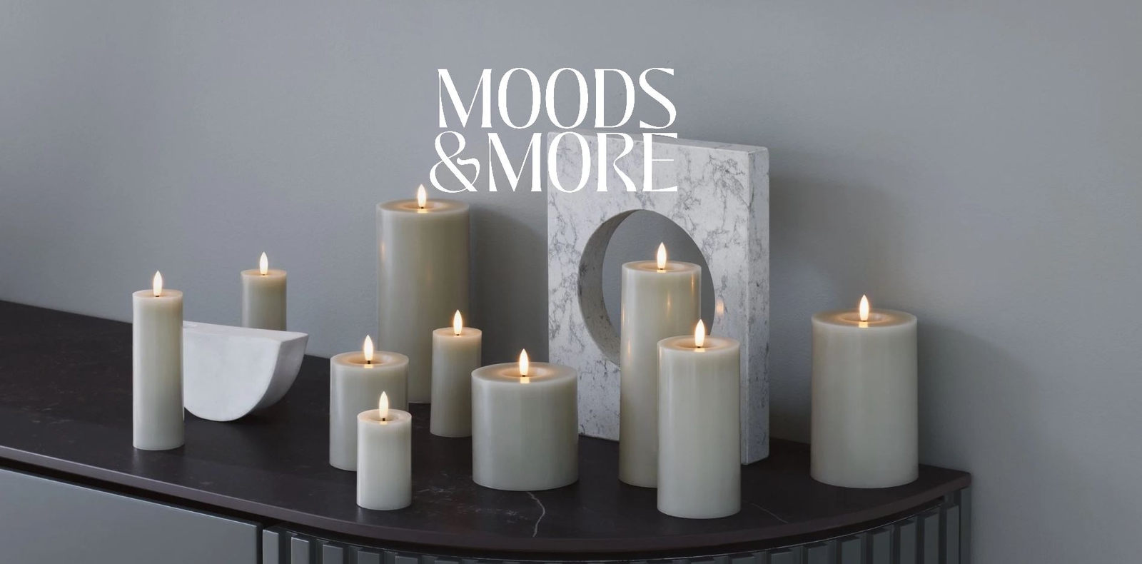 a bunch of candles are sitting on top of a table .