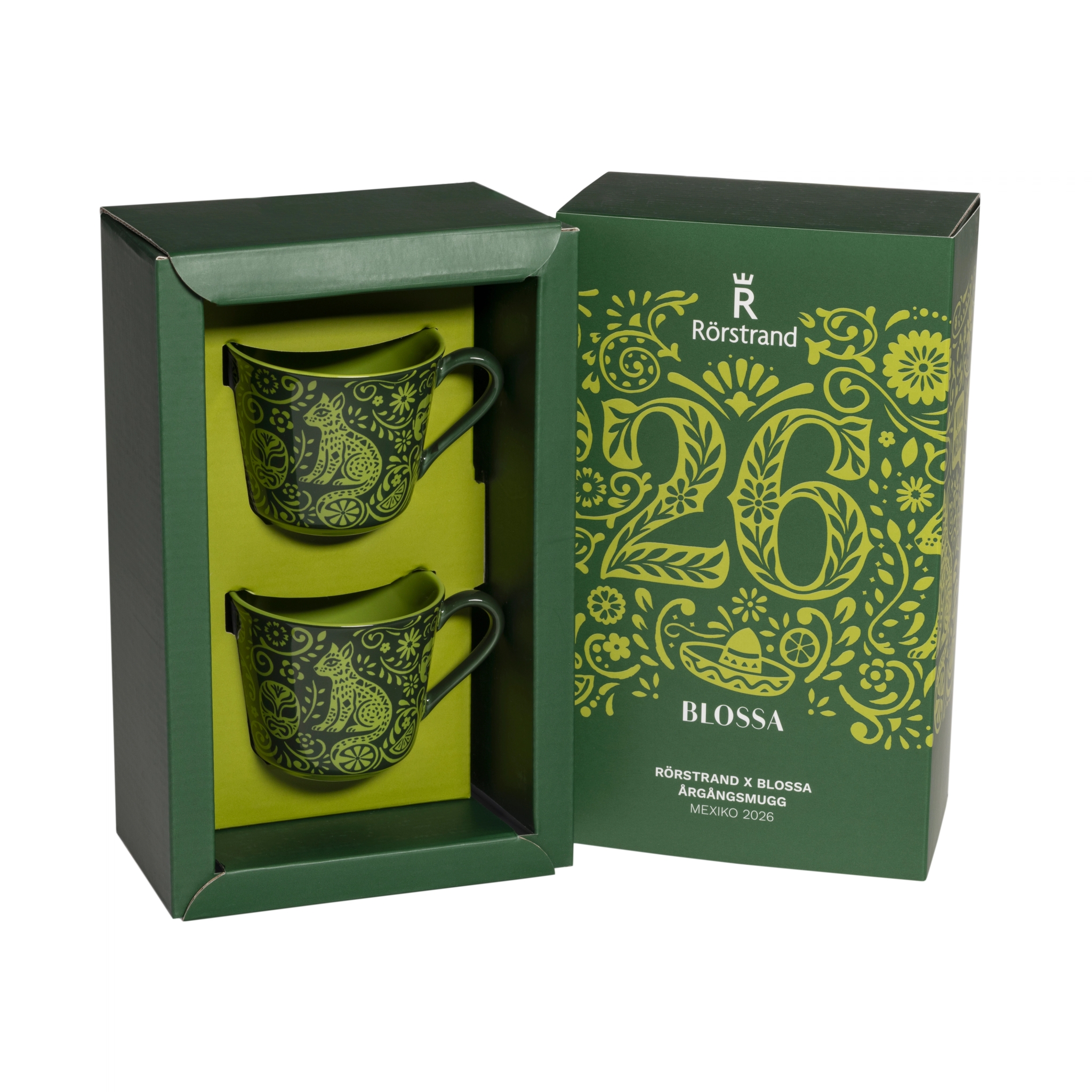 Två gröna Rörstrand x Blossa årgångsmuggar 2026 med mexikanskt inspirerat mönster i presentförpackning.