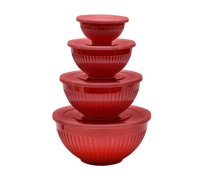 Four stacked red ribbed mixing bowls with lids.