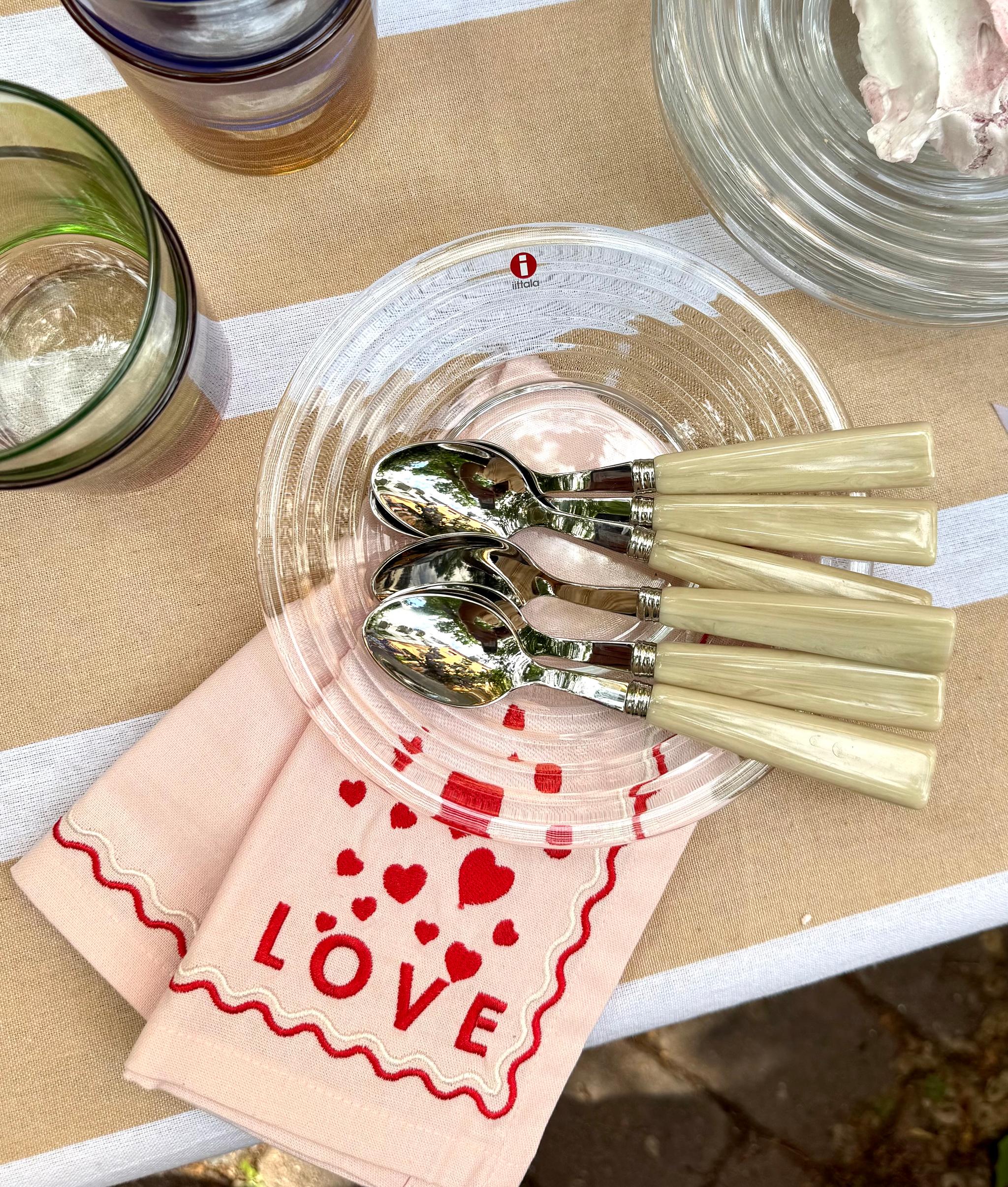 a napkin with hearts and the word love on it