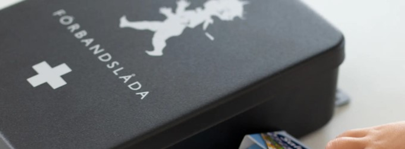 Förband, förbandslåda svart Solstickan