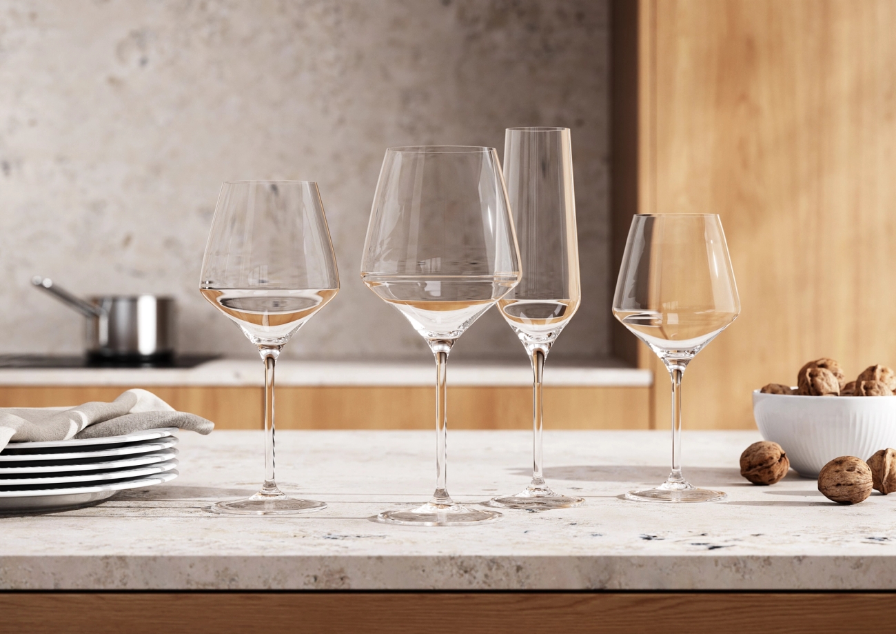 a group of wine glasses sitting on top of a counter .