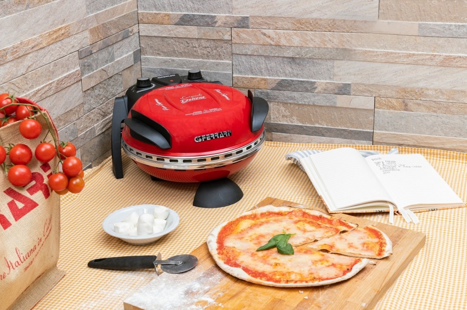 a pizza is sitting on a wooden cutting board next to a pizza oven .