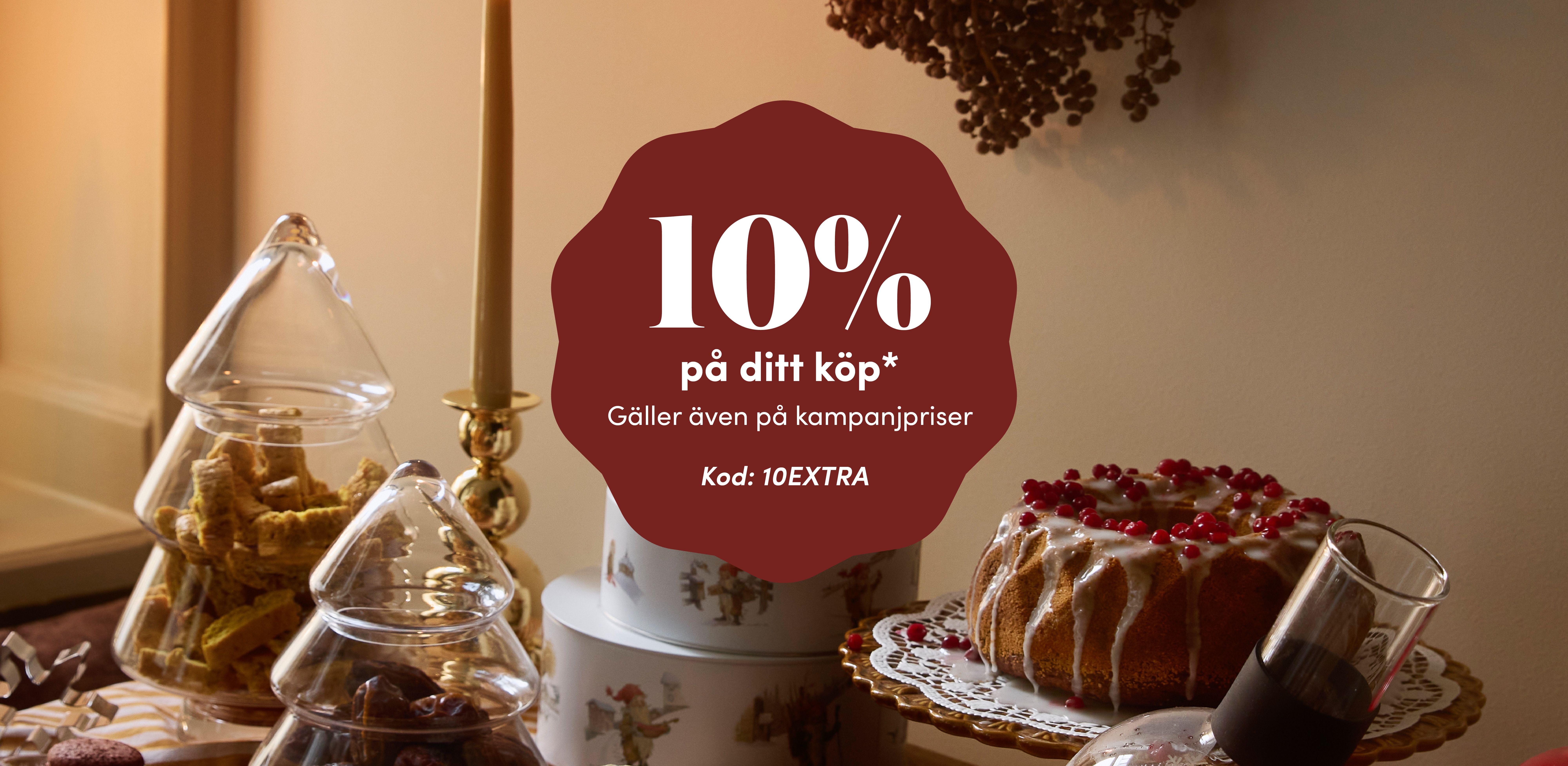 Christmas scene with an offer for 10% off your purchase, including sale prices, use code 10EXTRA.