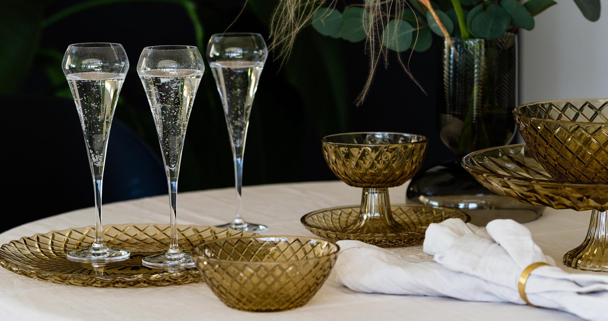 Chef & Sommelier Open Up Champagneglass med rosa bobler på hvit duk
