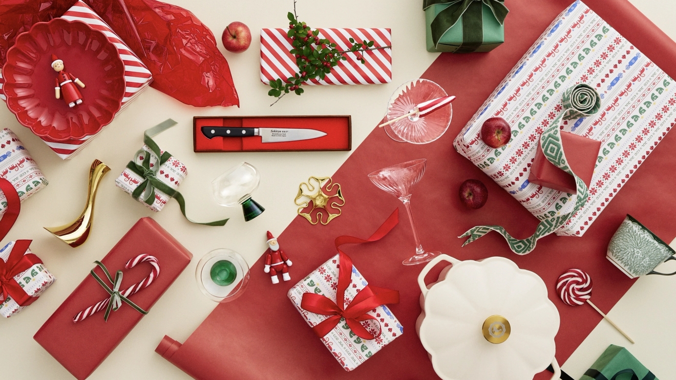 a table topped with a variety of christmas decorations and gifts .