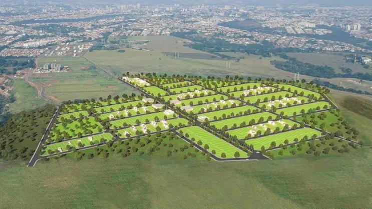 Ilustração aérea de um loteamento em encosta, com ruas e lotes demarcados cercados de vegetação e a cidade ao fundo