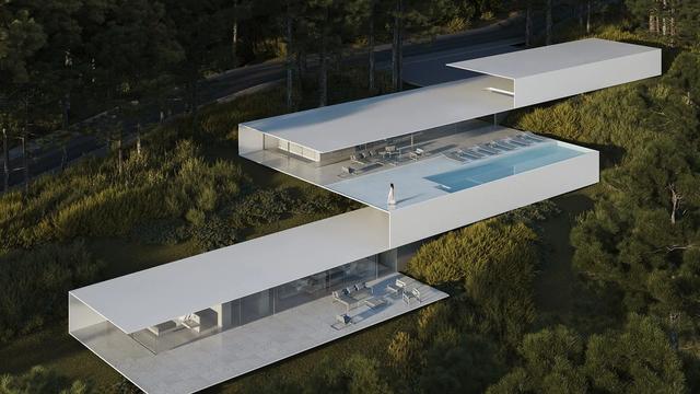 Vista aérea de uma casa branca de linhas retas, formada por dois volumes retangulares cruzados em balanço sobre a encosta arborizada, com piscina no nível superior.