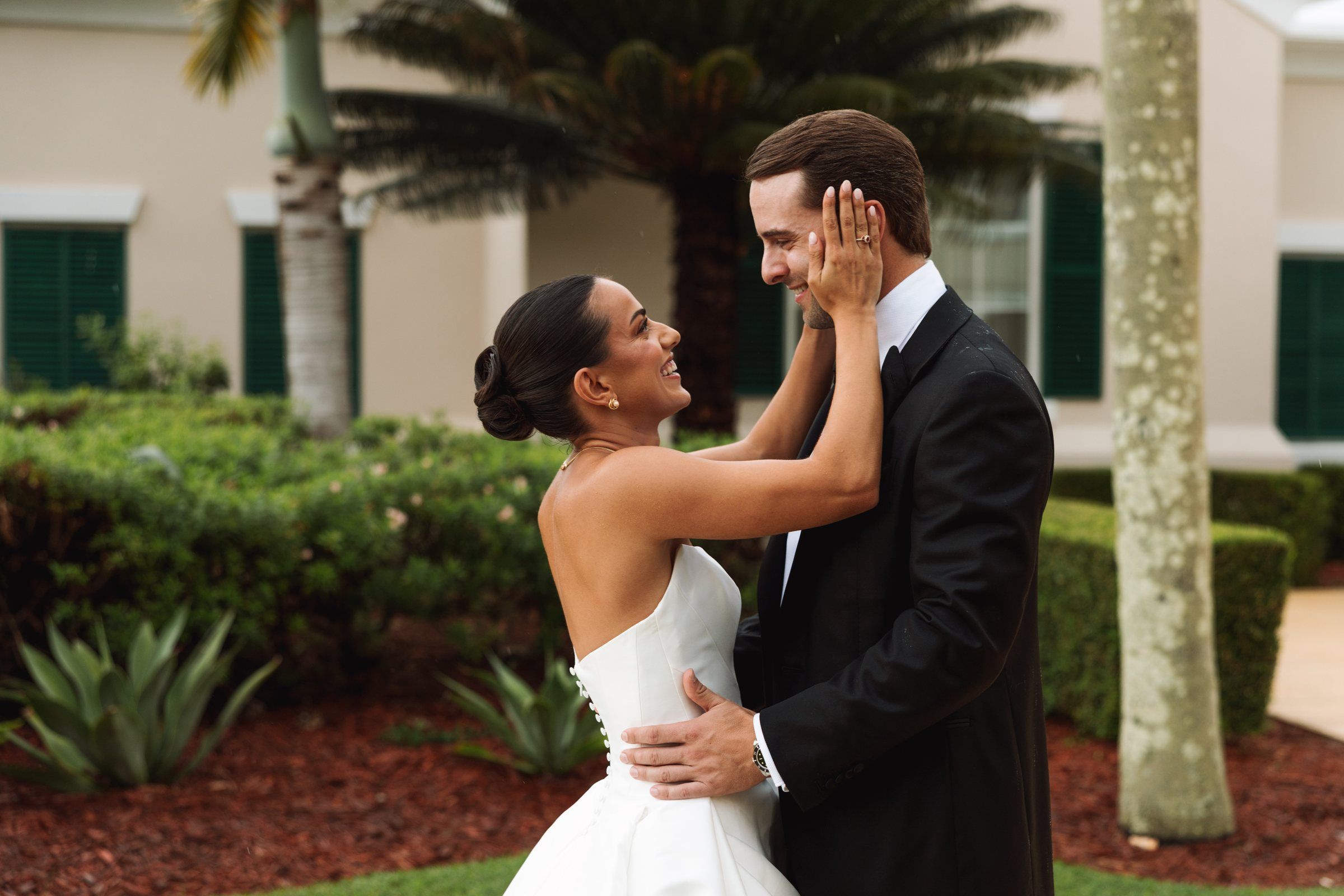 Juliana holds Casey's face after their first look at Rosewood Bermuda