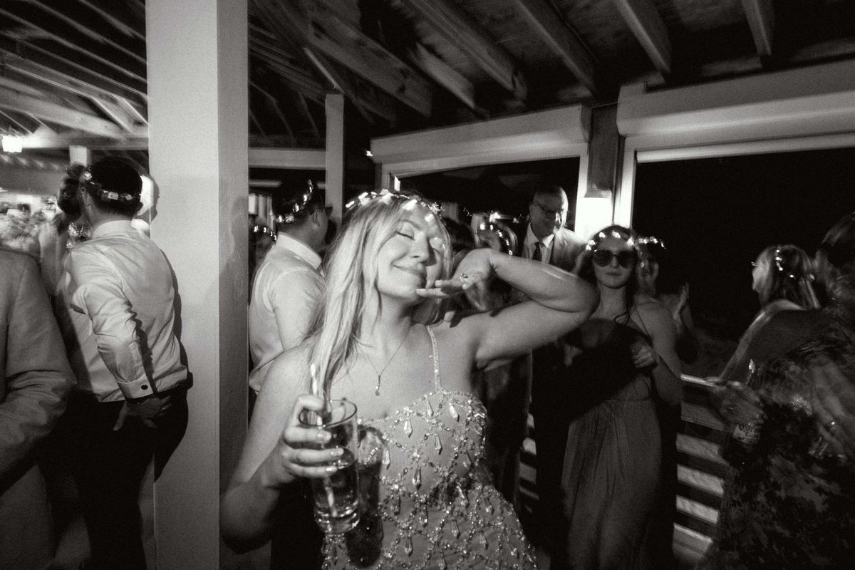 Black and white photograph of bride dancing late night at Bermuda wedding reception