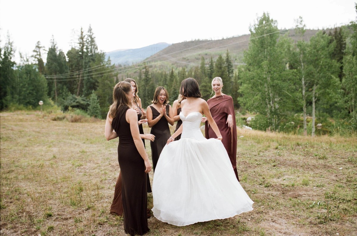 Devin twirls her gown with her bridesmaids in brown dresses, shot on film at a mountain ranch among the aspens