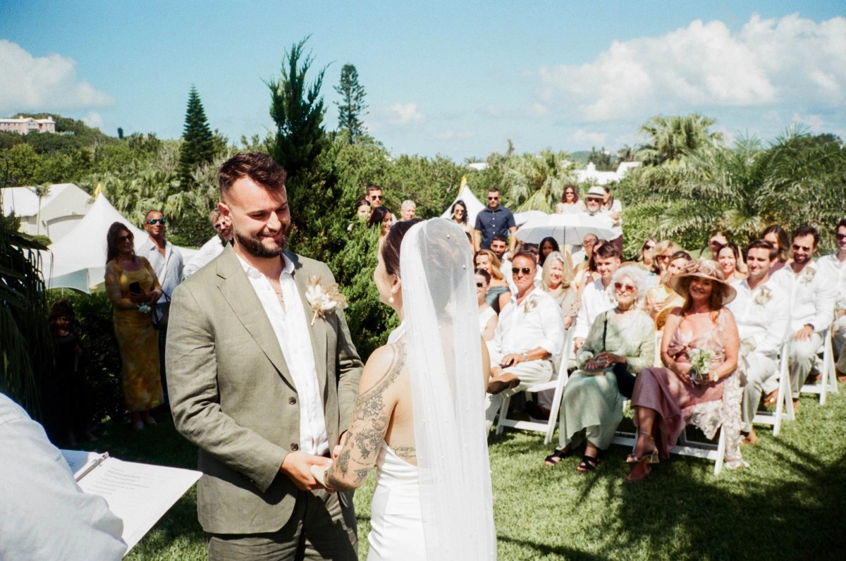 Groom and bride at the altar during a Bermuda garden ceremony, shot on film