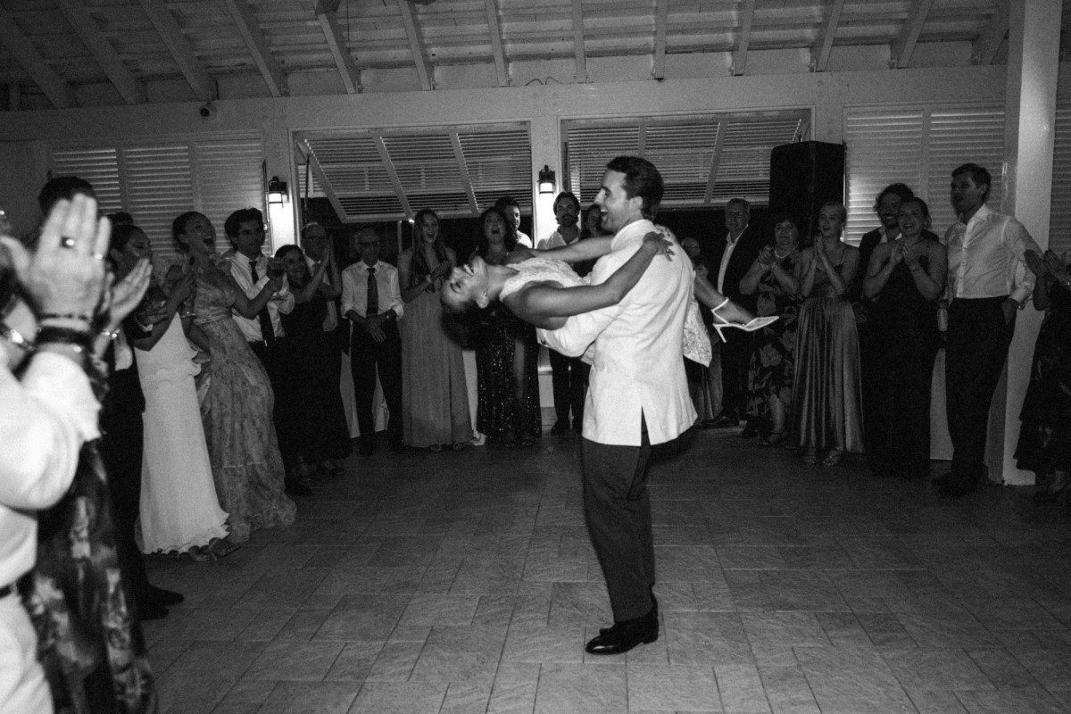 Groom dipping the bride during their first dance at Rosewood Bermuda, black and white