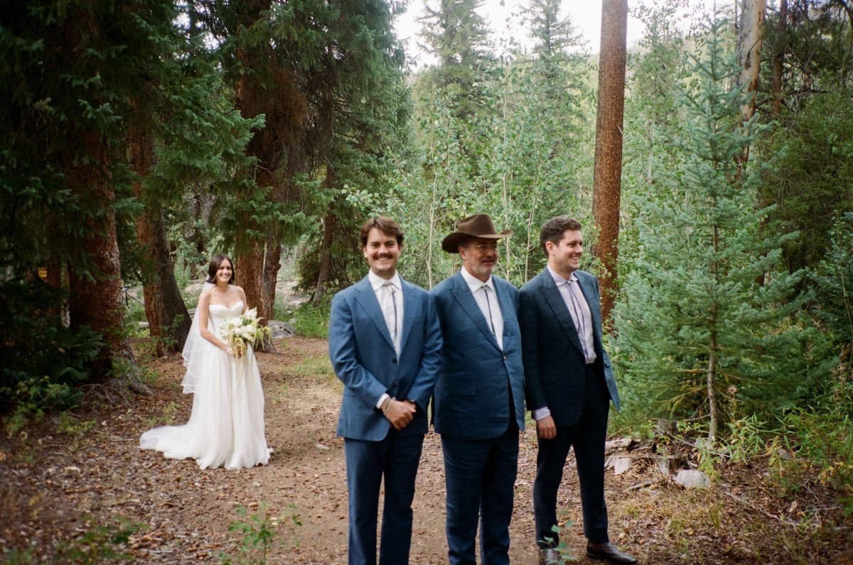 Devin with her father and family before the ceremony, shot on film at a mountain ranch among the aspens