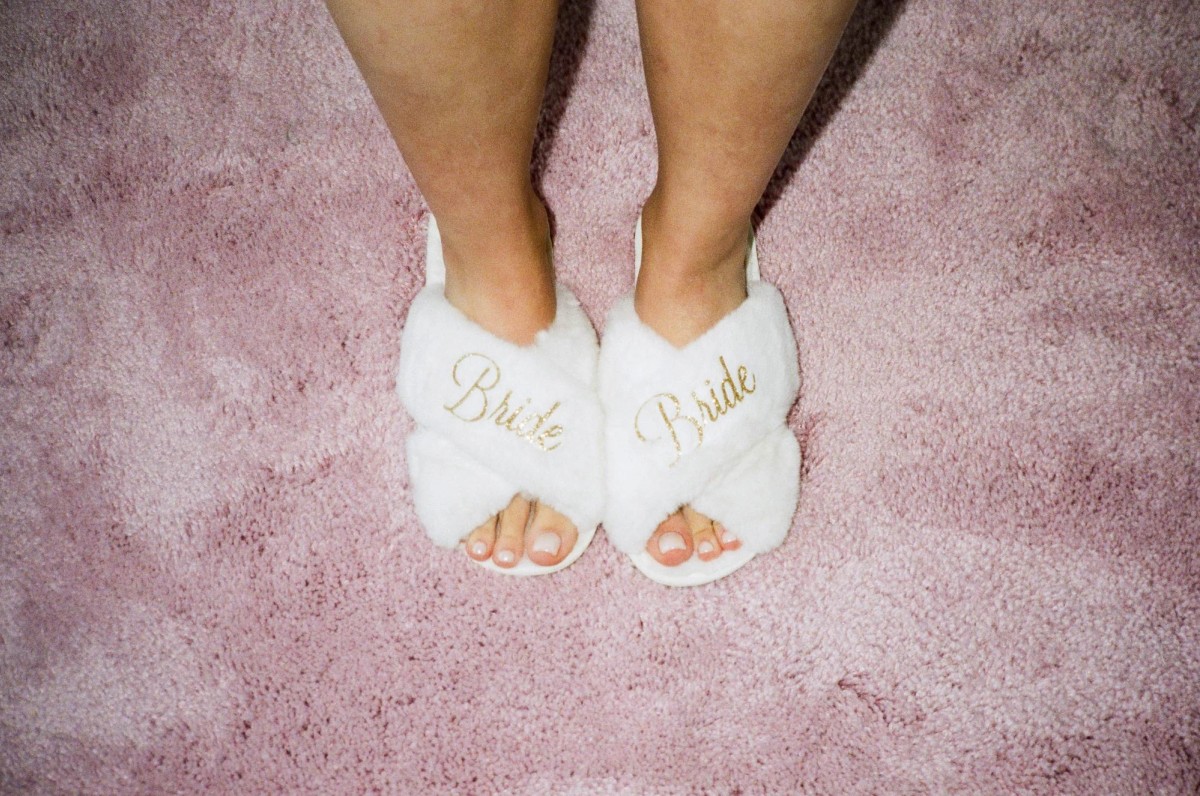 Bride slippers on a pink rug on the morning of a Bermuda wedding, shot on film