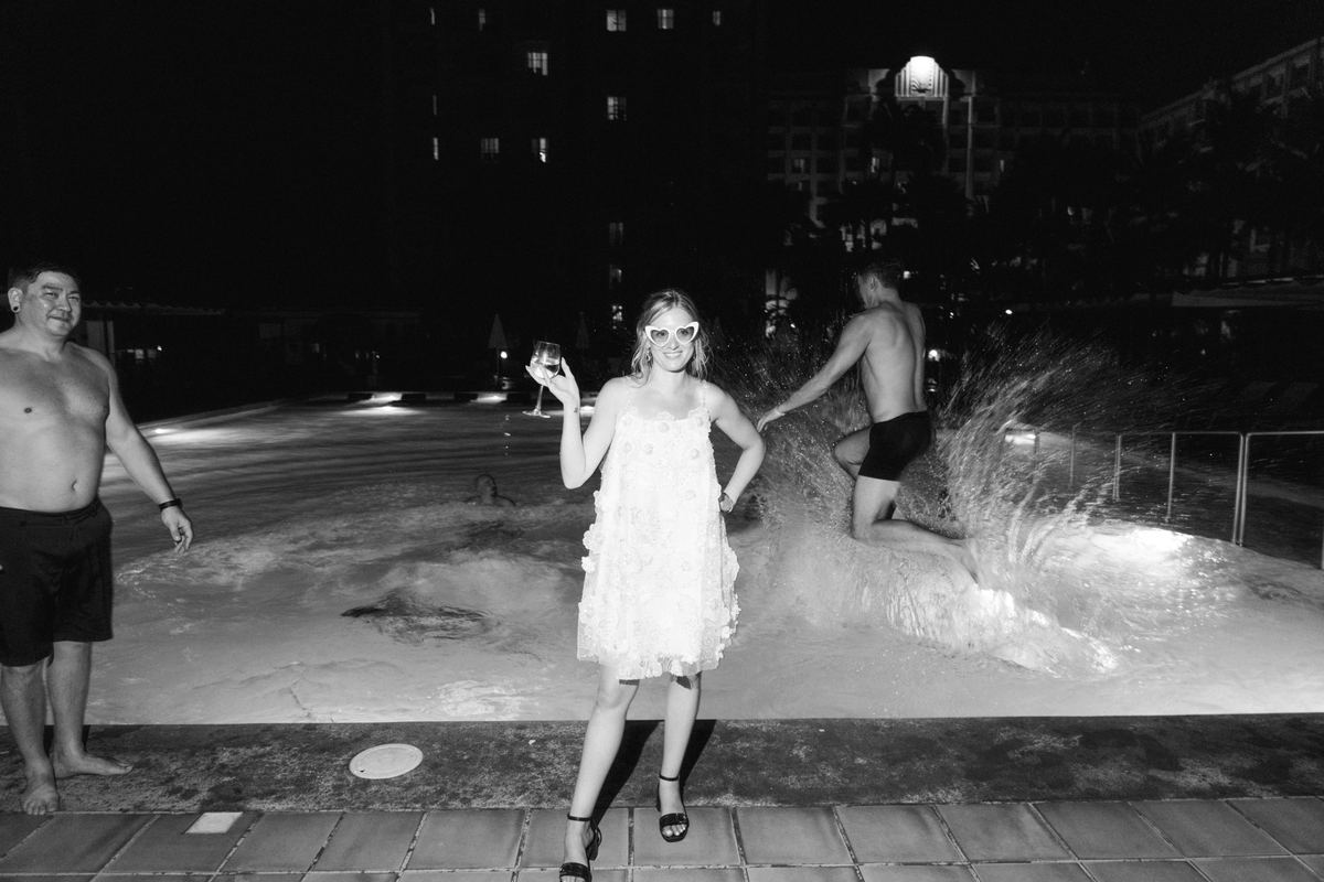 Bride in pool, black and white artistic wedding photography
