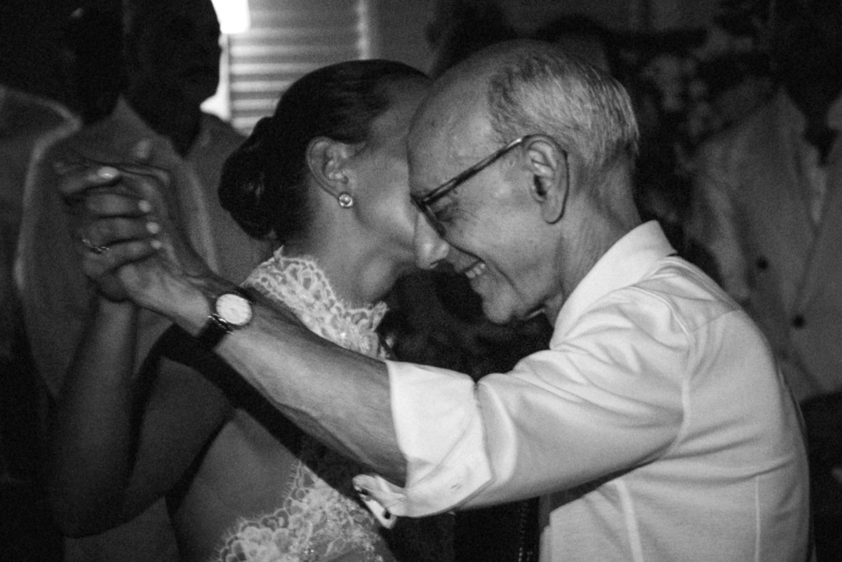 Bride and her father dancing cheek to cheek at Rosewood Bermuda, black and white