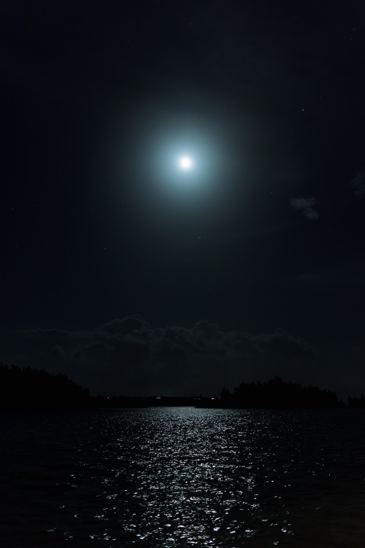 The moon over the water at the end of the night on Hawkins Island, Bermuda
