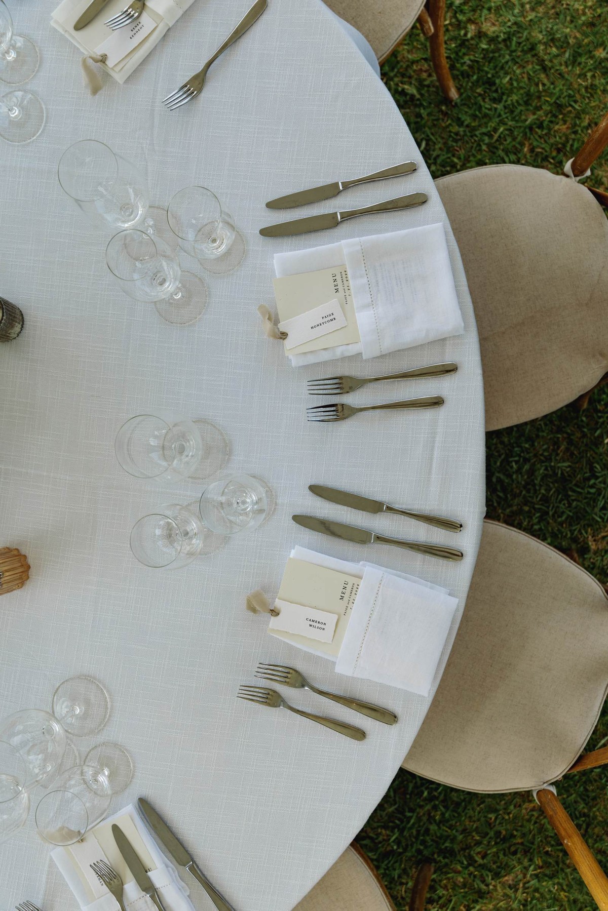 Overhead view of a reception table set with linen and glassware on Hawkins Island, Bermuda