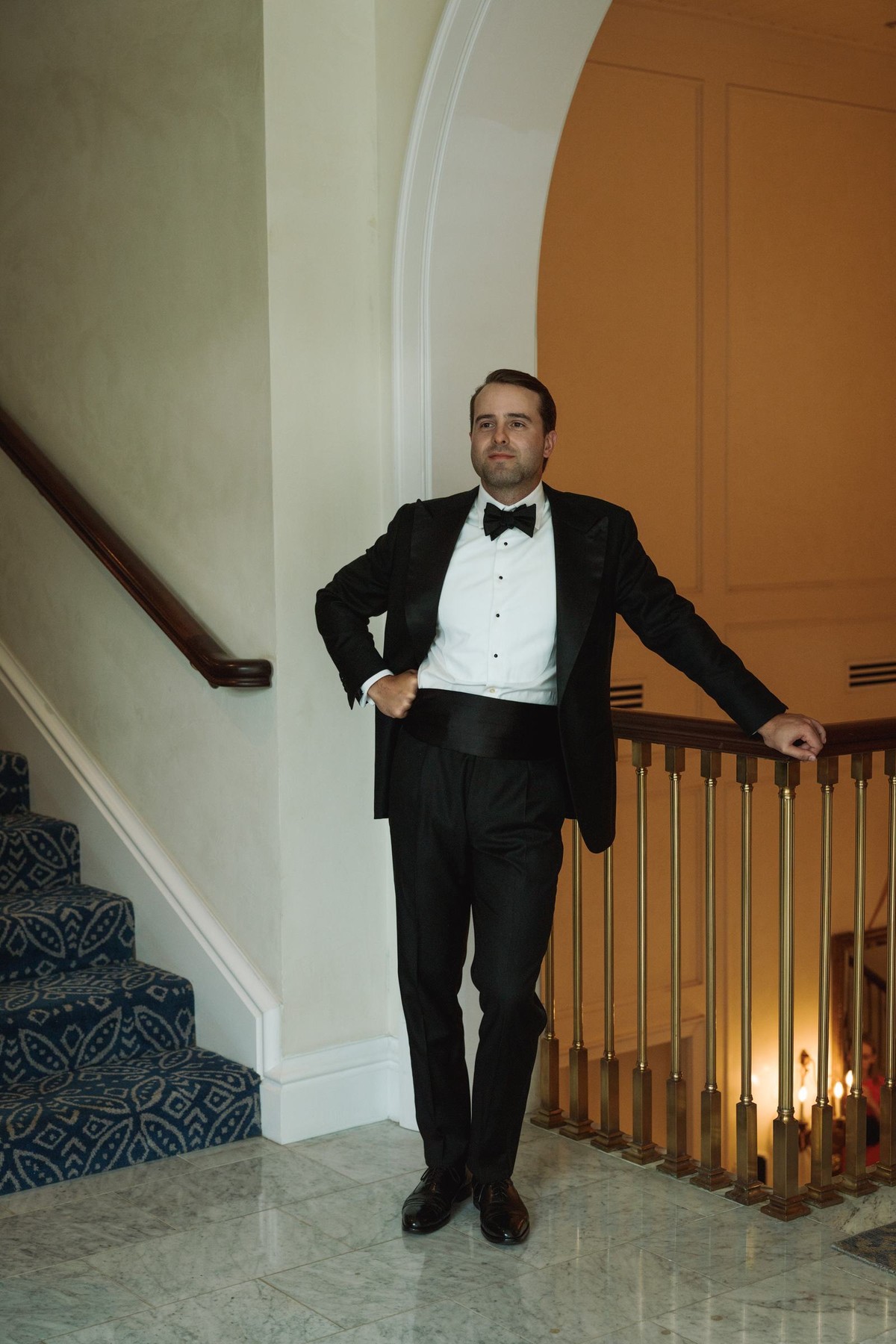 Groom waiting at the top of the staircase before the ceremony at Rosewood Bermuda