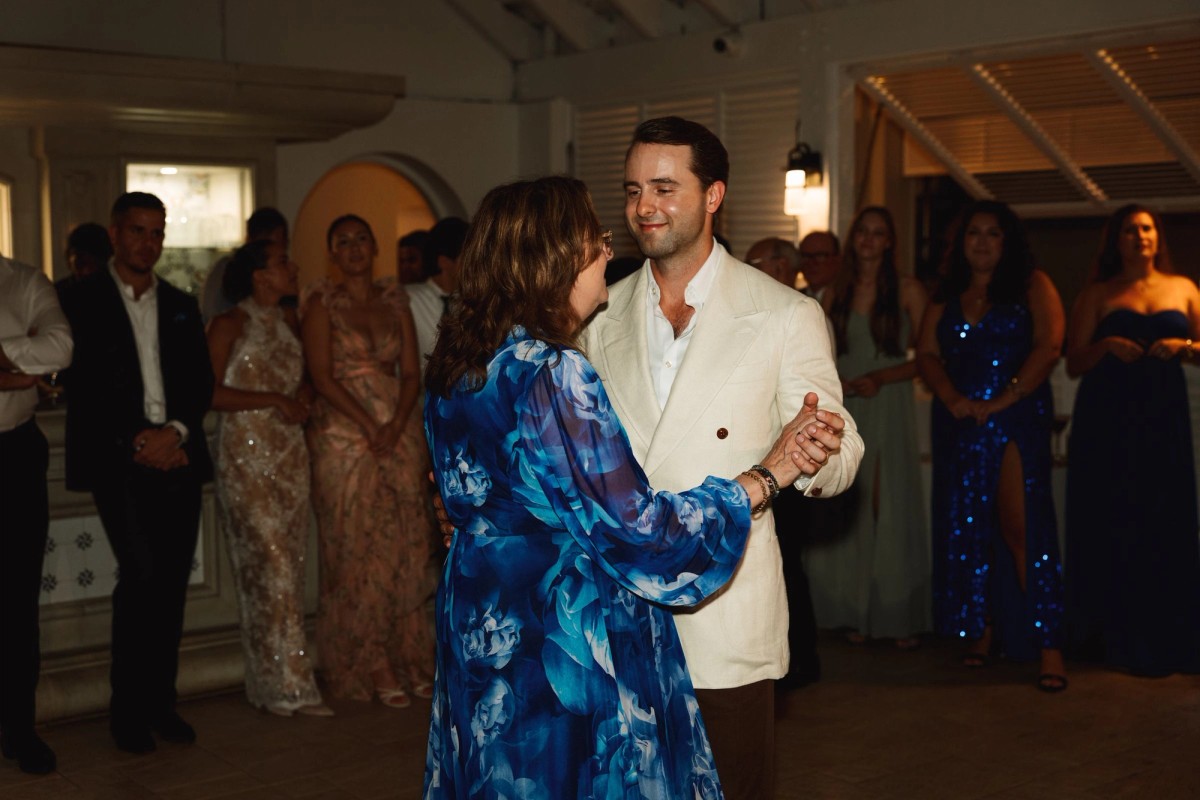 Groom dancing with his mother on the crowded dance floor at Rosewood Bermuda