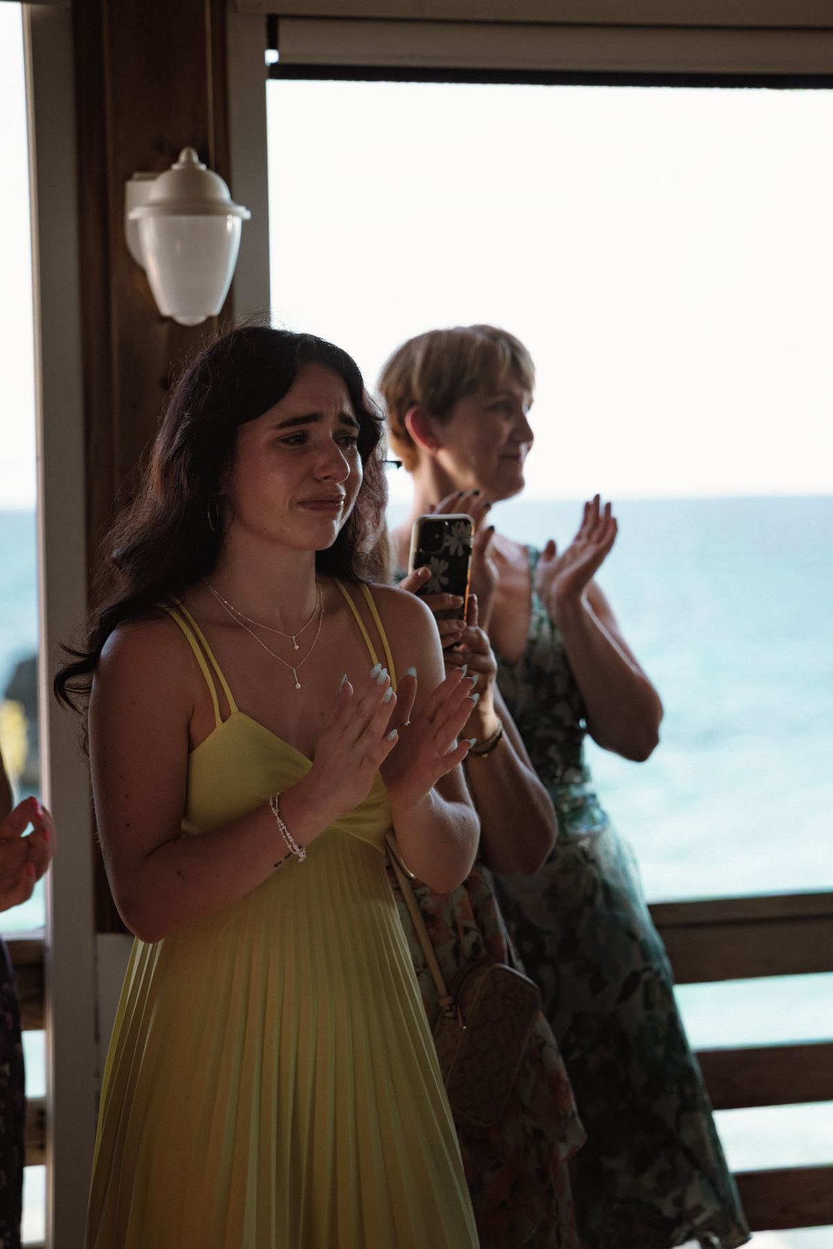 Candid guest reaction during speeches at Bermuda wedding reception