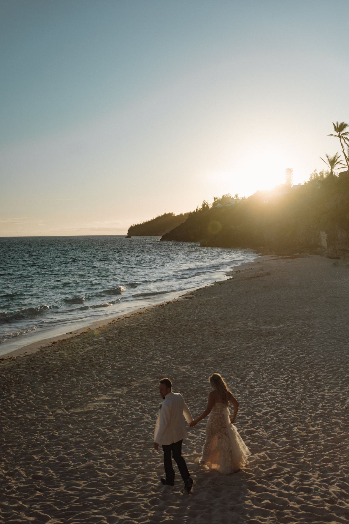 Silhouette of couple on Bermuda beach at sunset