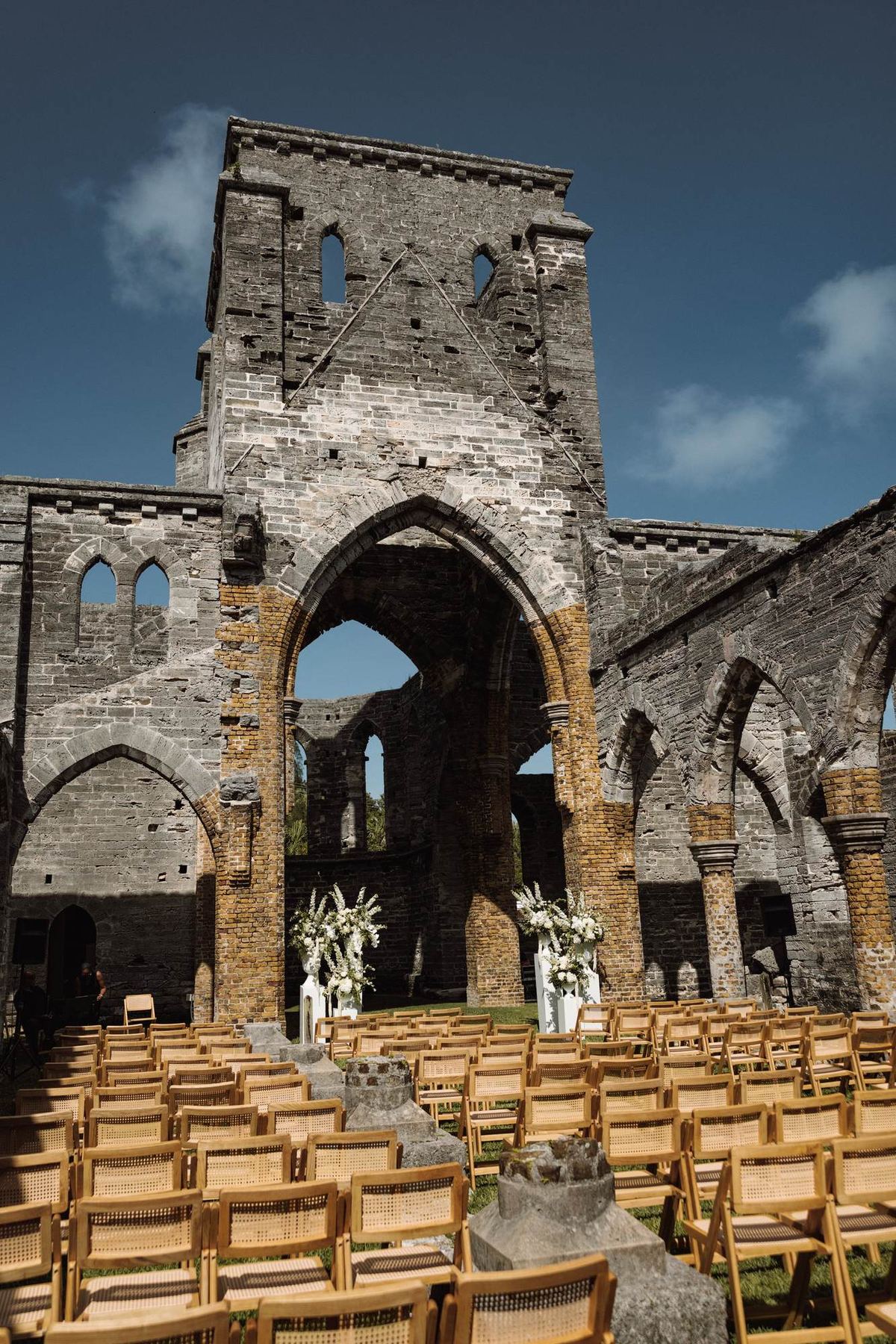 Wooden ceremony chairs set inside the historic Bermuda church ruins