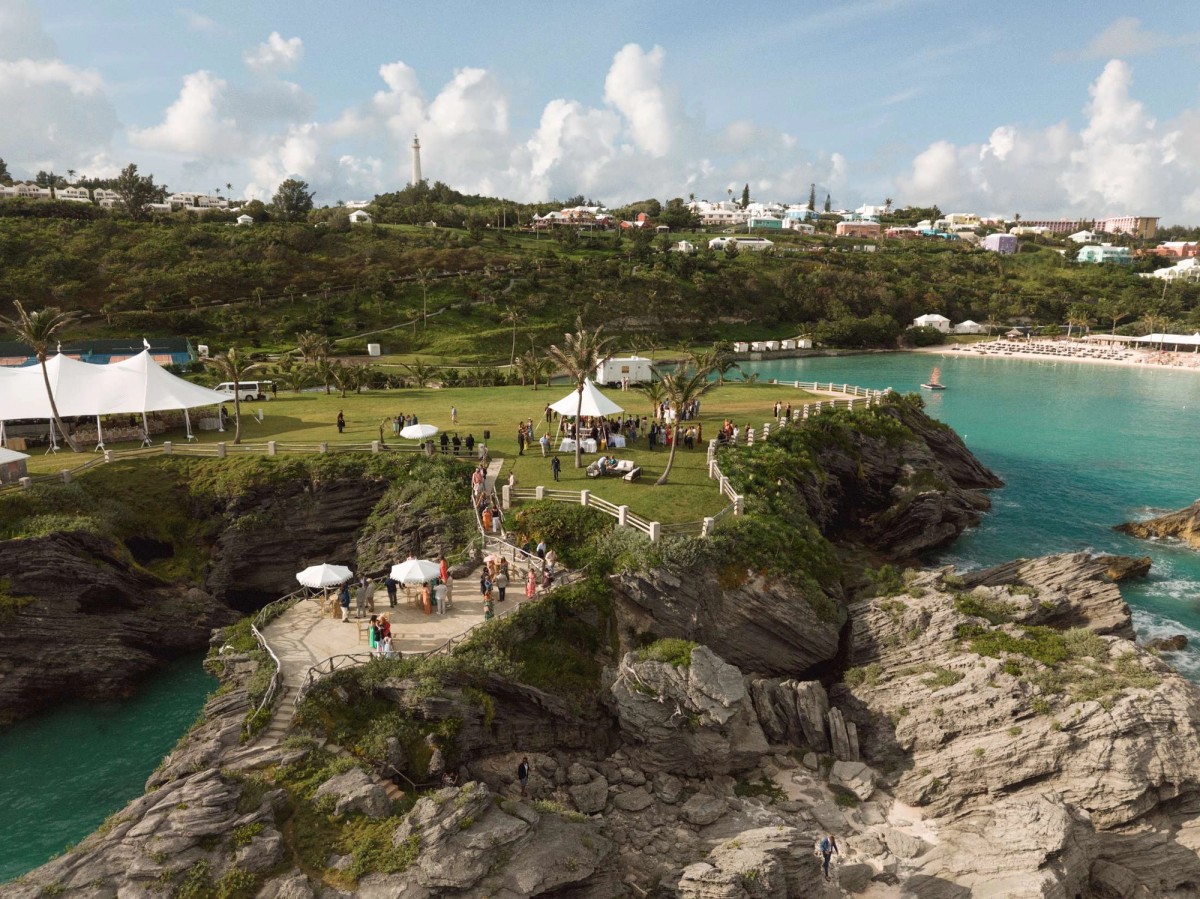 Aerial view of a Bermuda cove with the reception tent above the beach