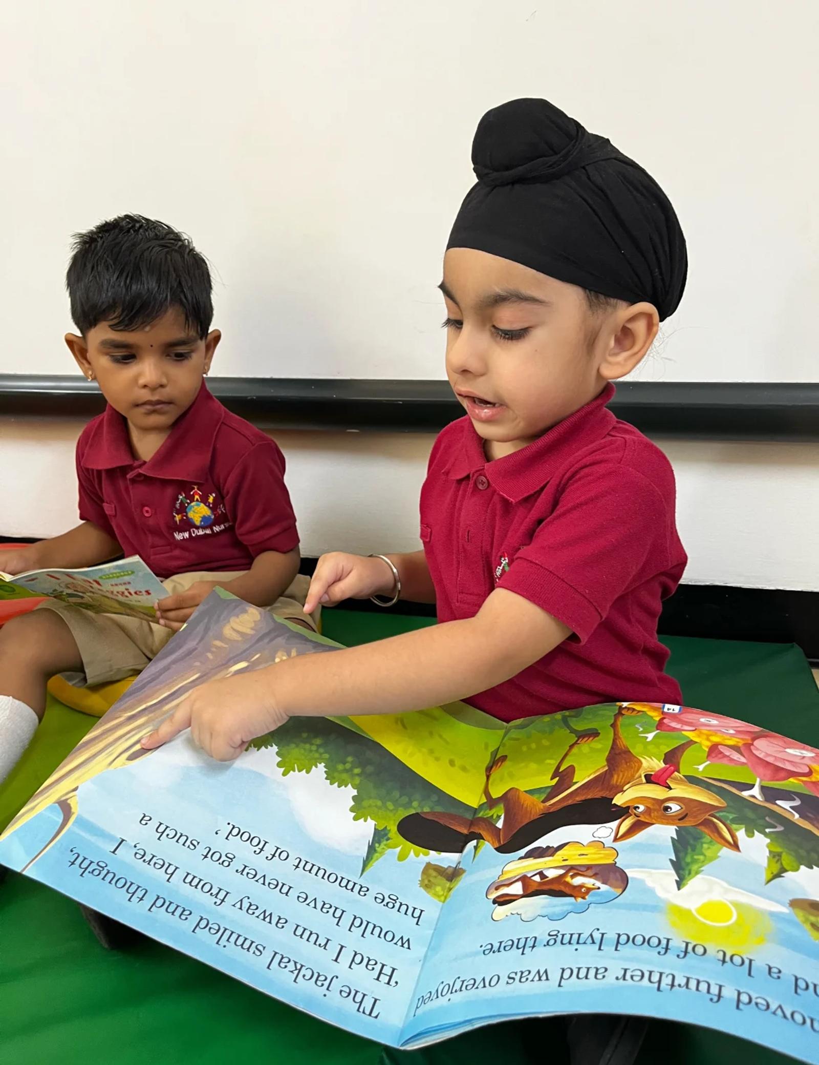 Children sharing a picture book