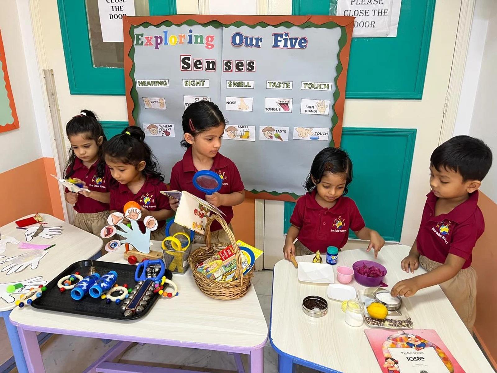 Children exploring a five-senses activity together