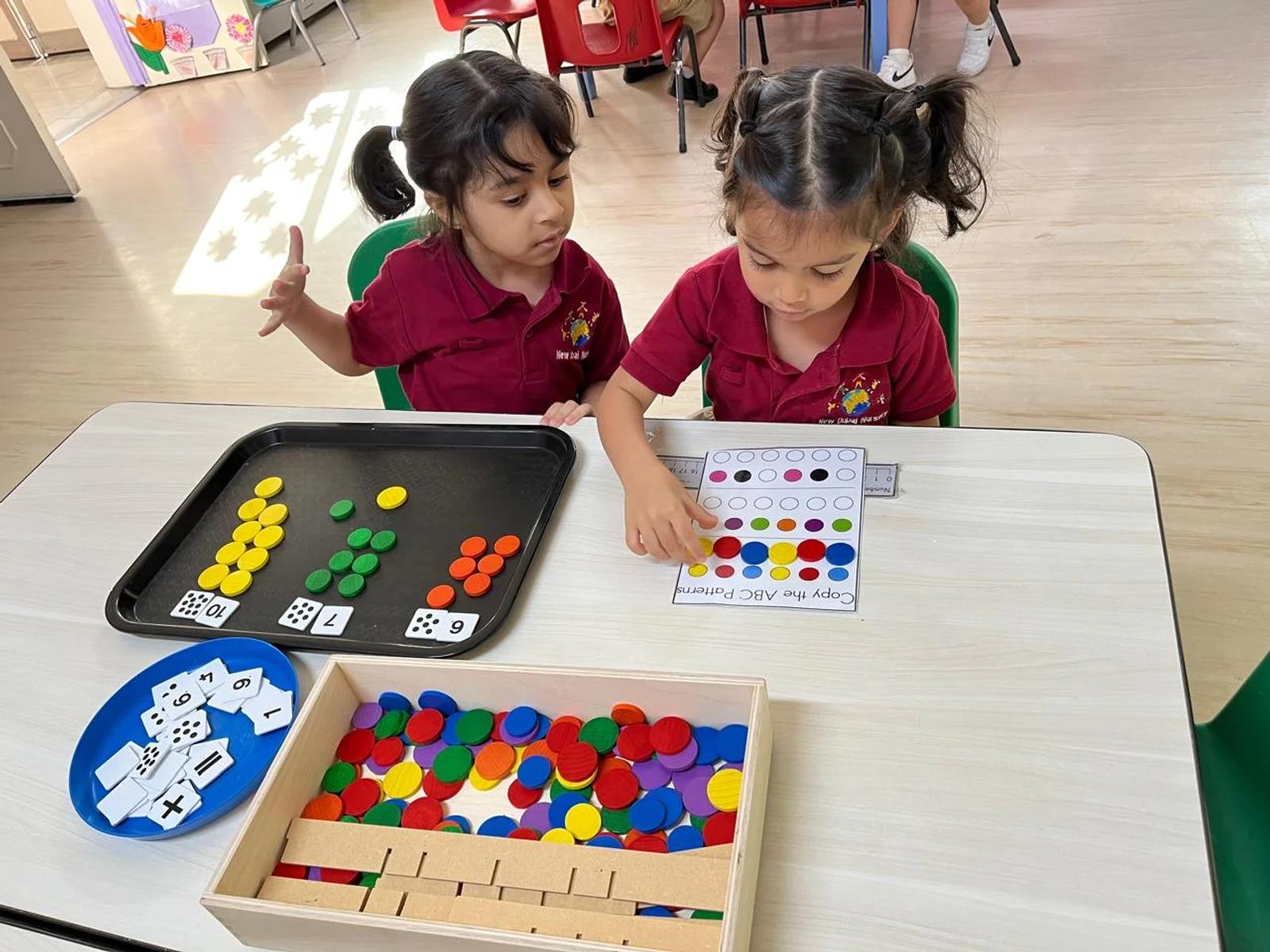 Children counting and sorting colourful counters