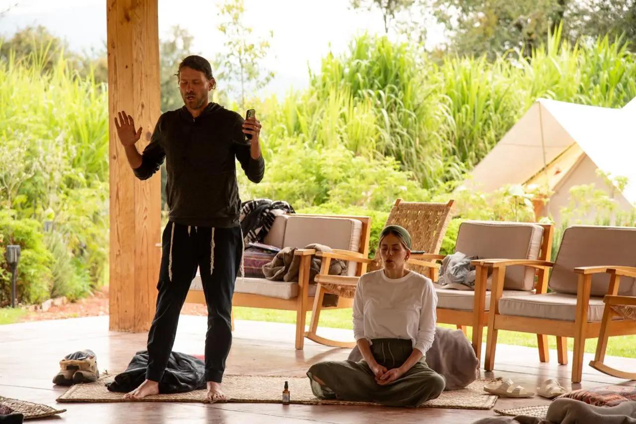 Guided session under a pergola overlooking the gardens