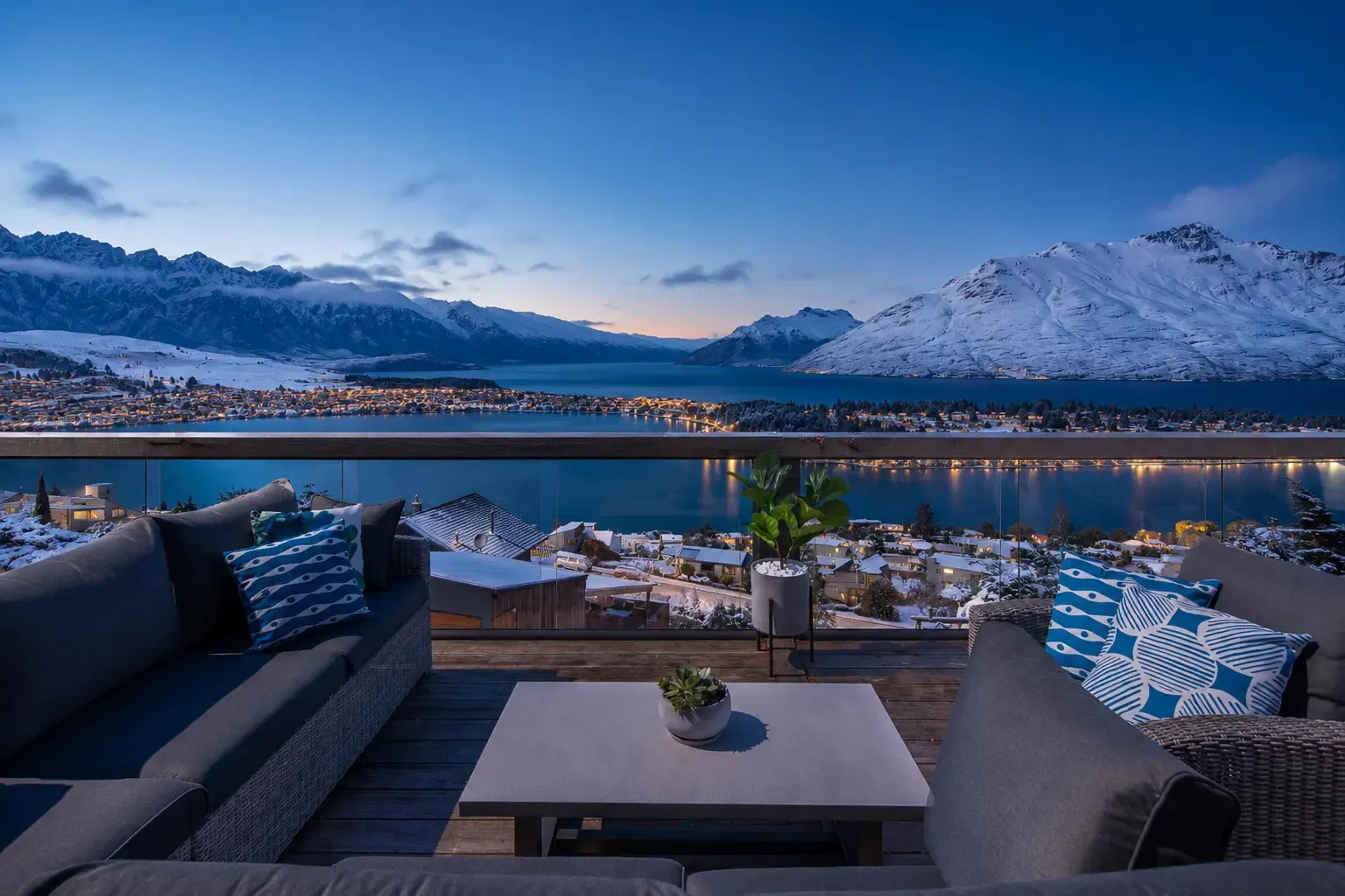 Snow-capped Queenstown mountains across the lake in winter