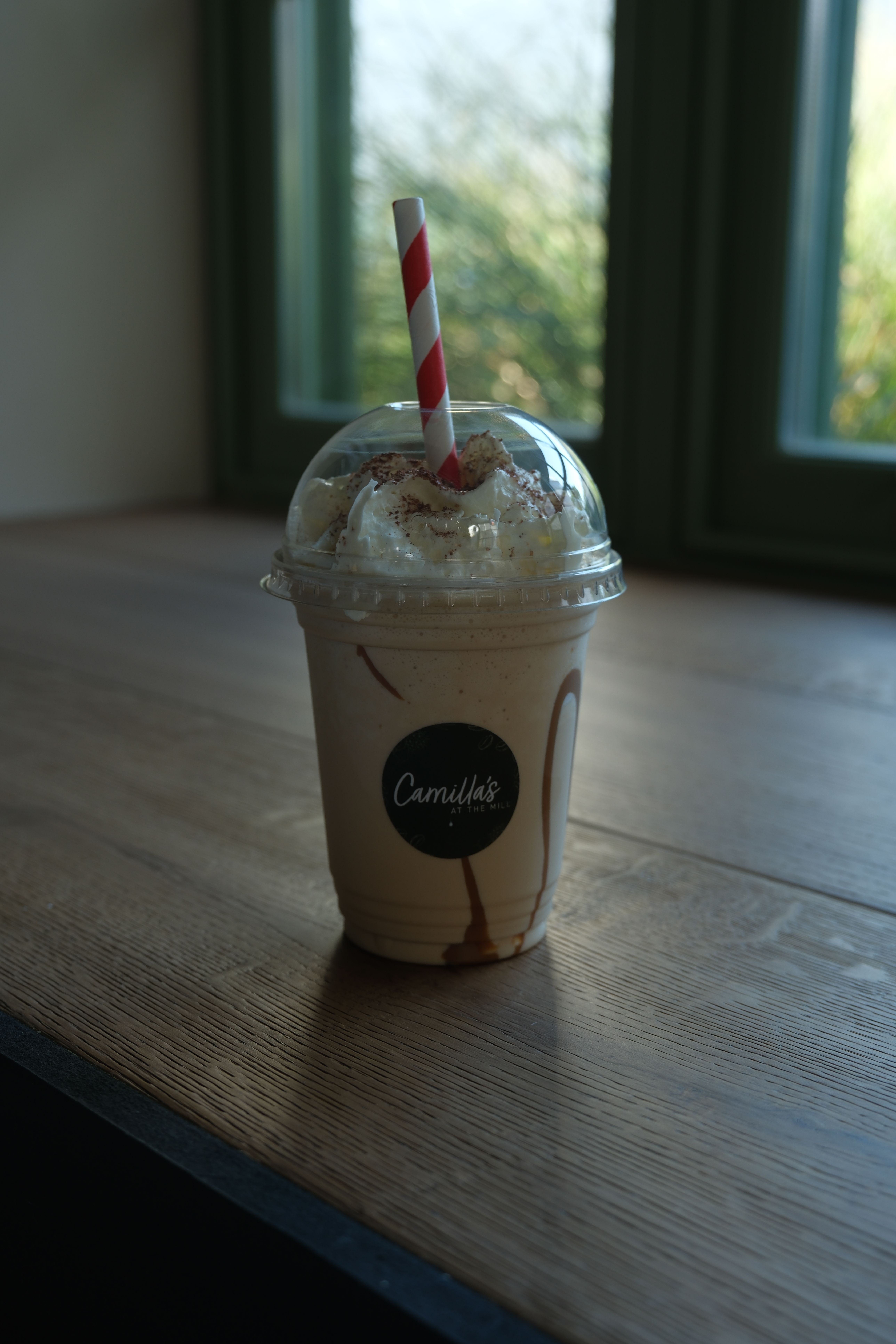 A salted caramel milkshake topped with cream