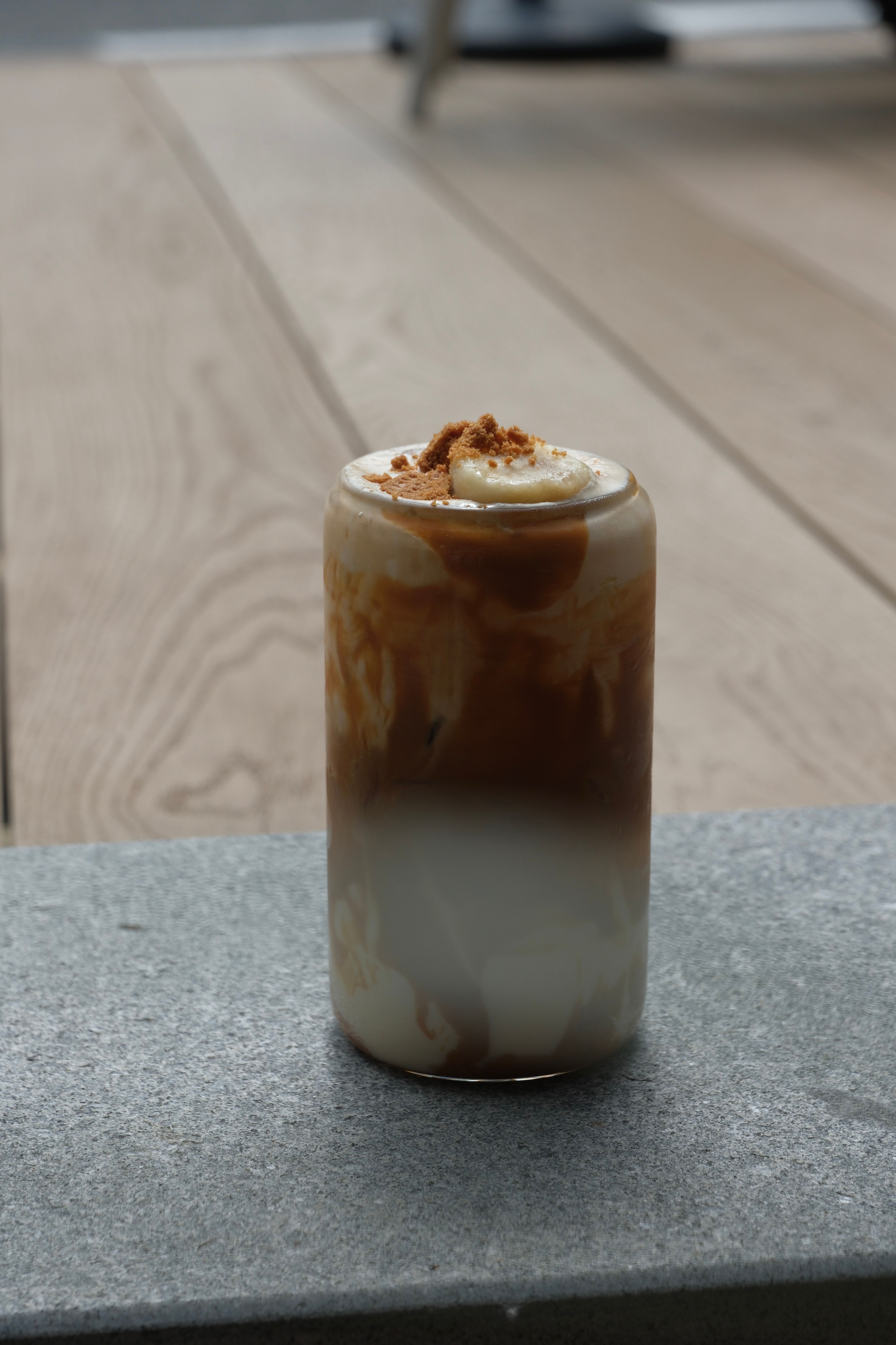 caramelised banana iced latte in a glass