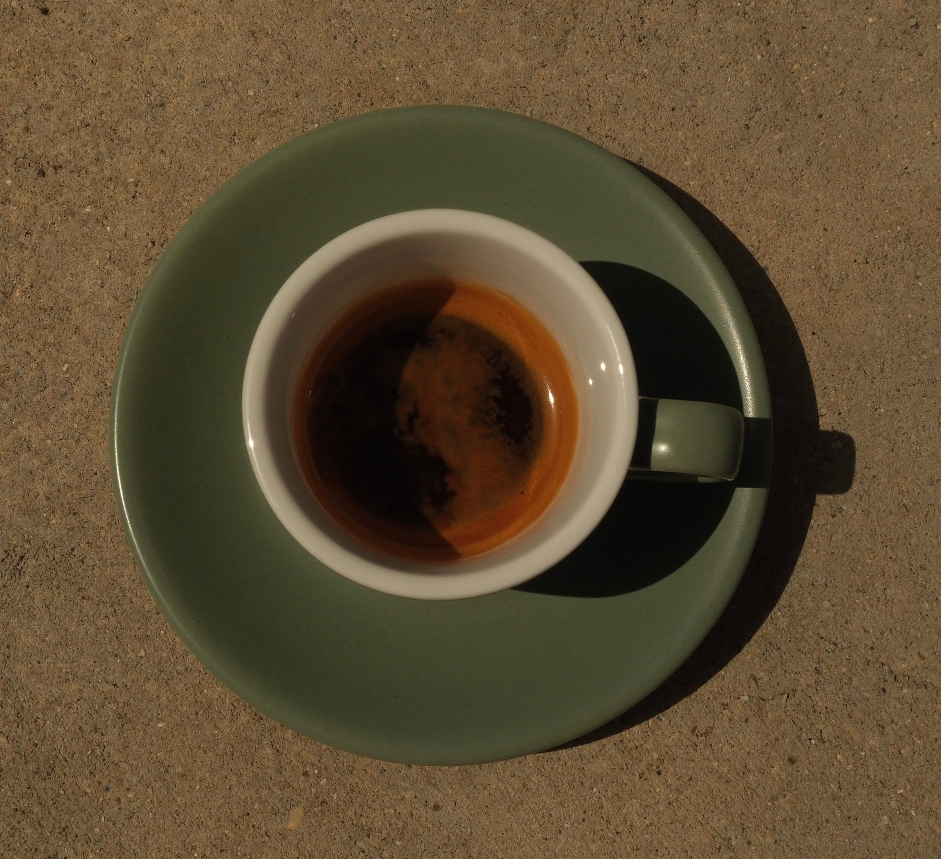 A shot of espresso in a small cup