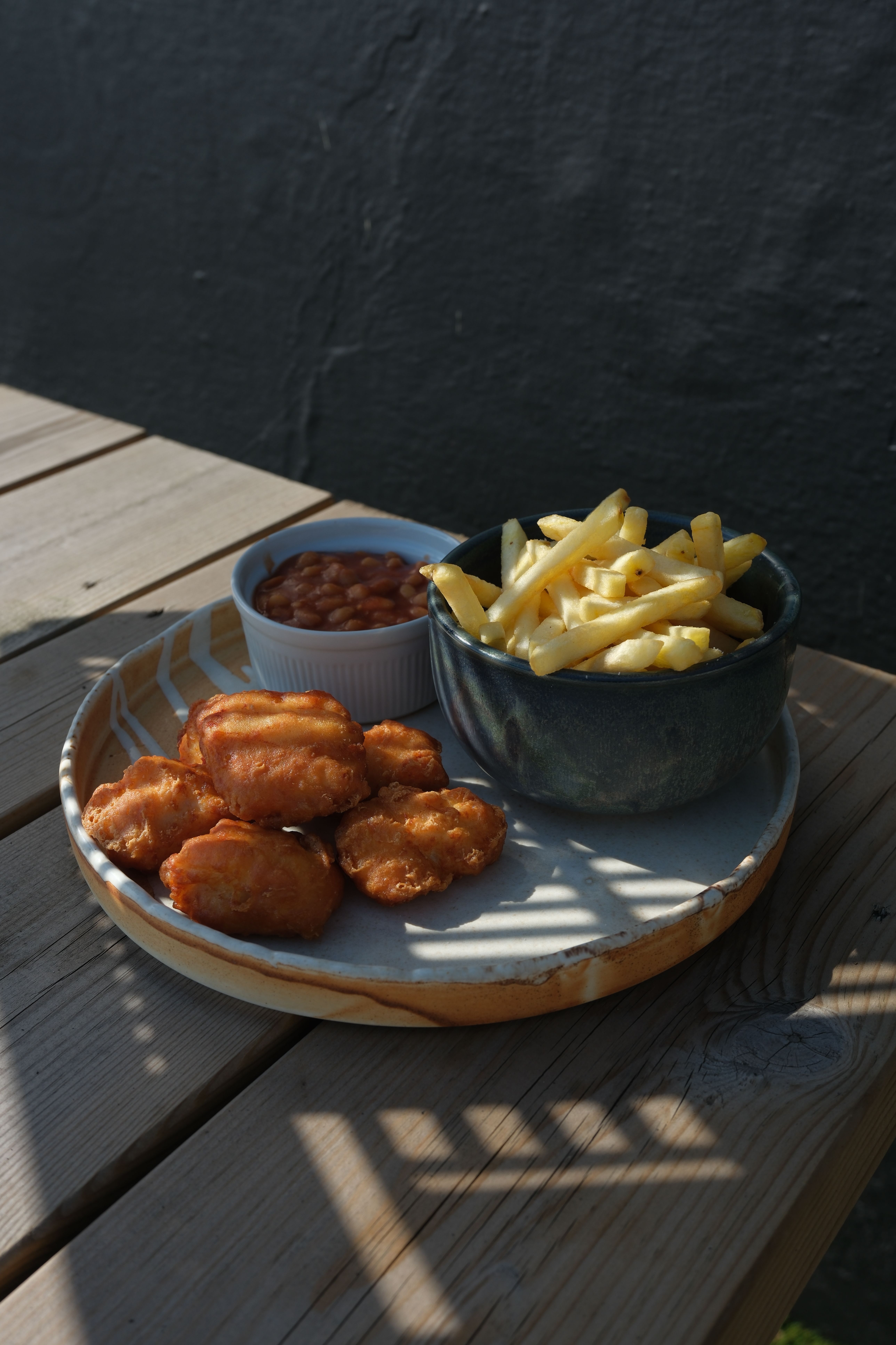 Chicken nuggets with chips and beans
