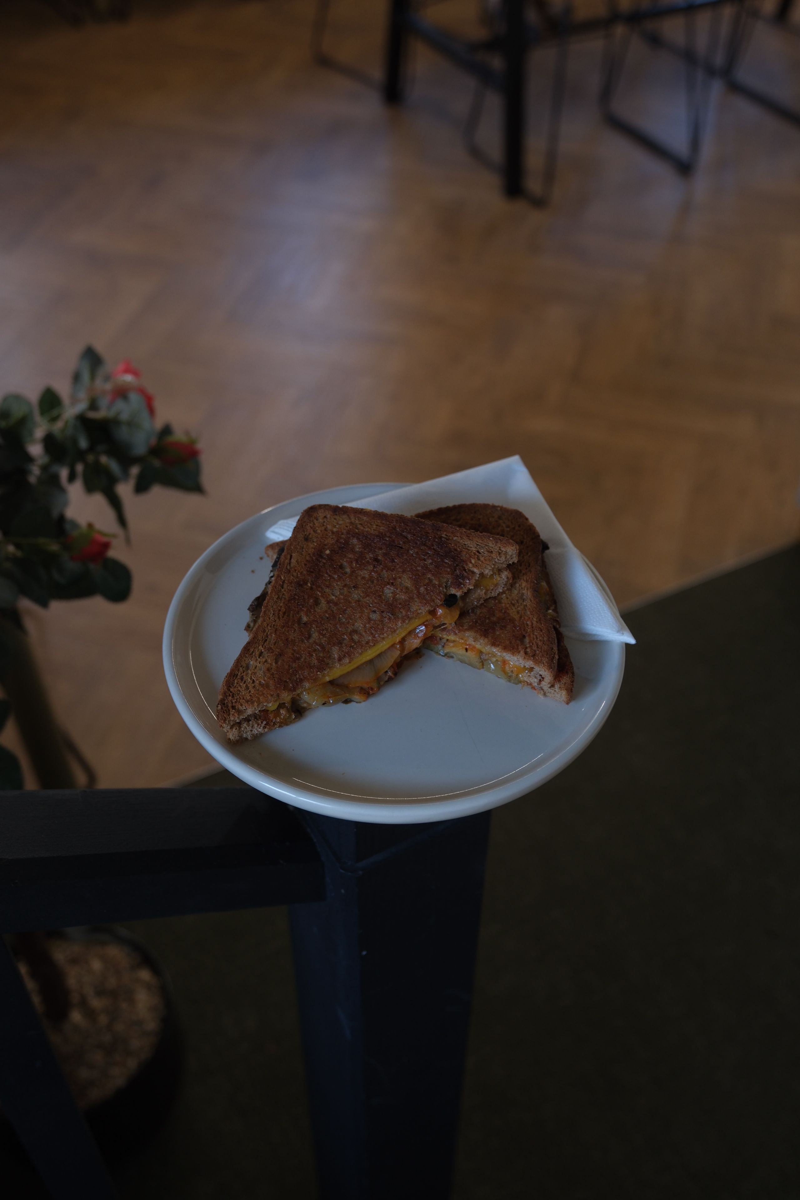 A toasted veggie melt with peppers and avocado